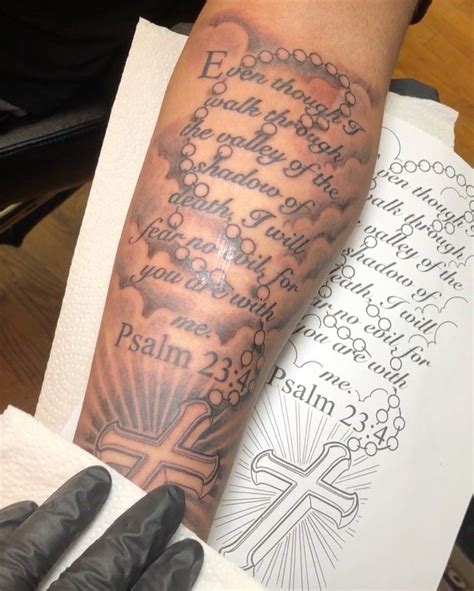 A great design which explores the artist creativity and shows his unique style when it comes to half sleeve tattoo design. . Half sleeve scripture tattoos with clouds